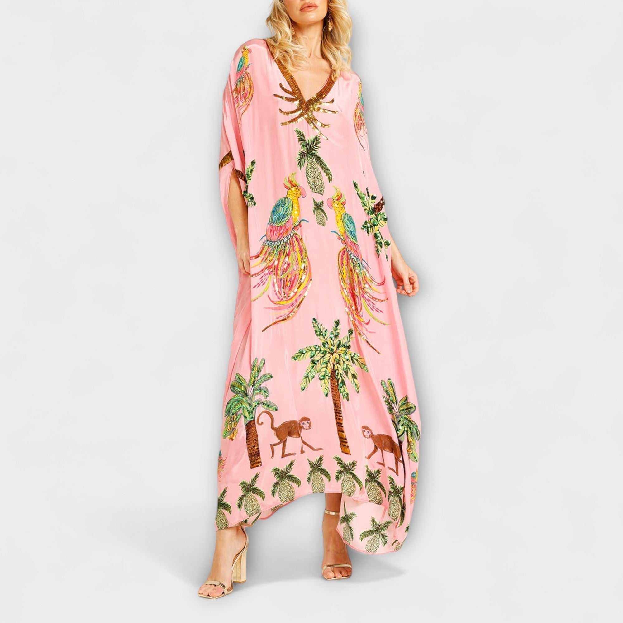 Linda - Iögonfallande klänning med off-shoulder-design och kokosnötsträdsmönster