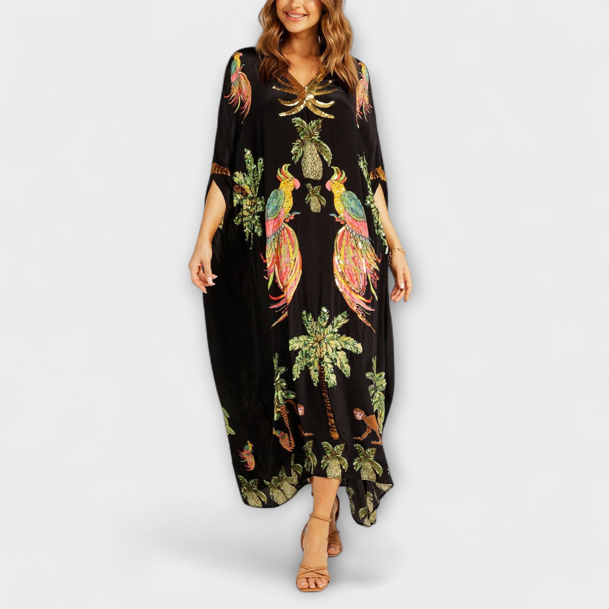 Linda - Iögonfallande klänning med off-shoulder-design och kokosnötsträdsmönster
