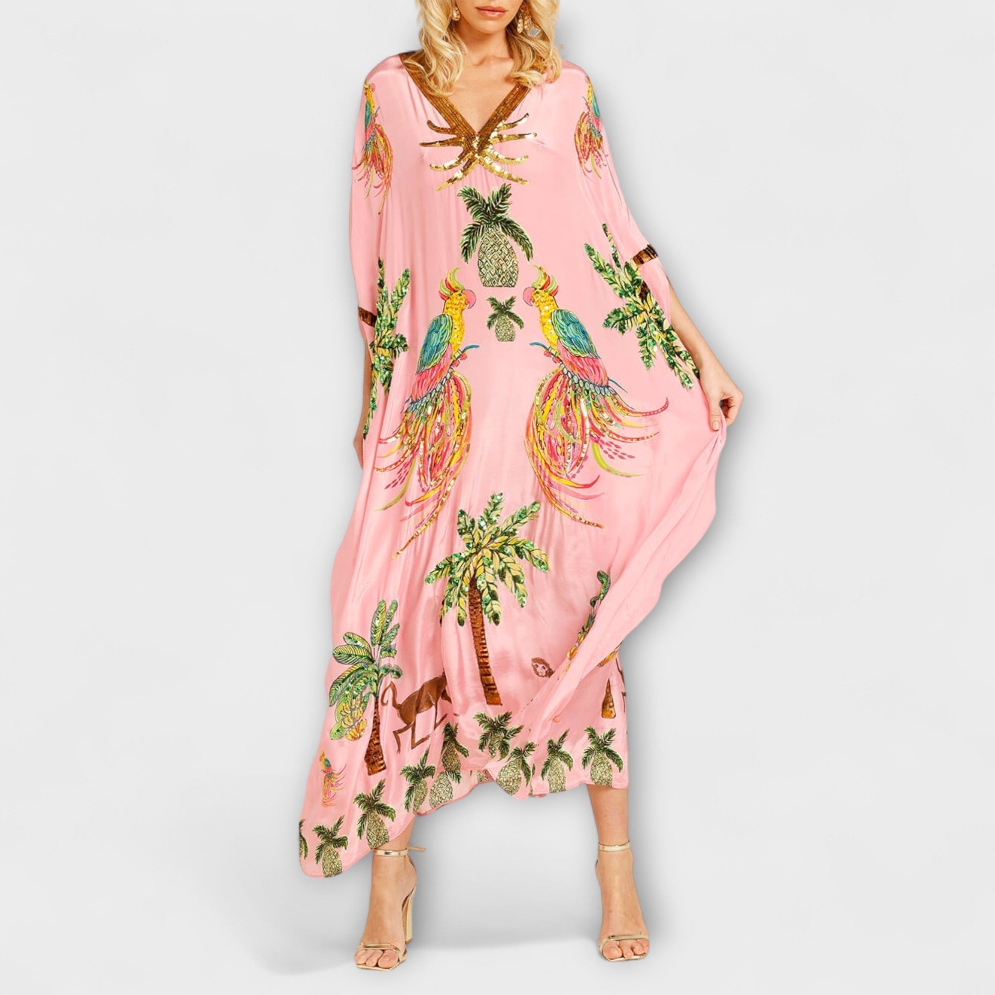 Linda - Iögonfallande klänning med off-shoulder-design och kokosnötsträdsmönster