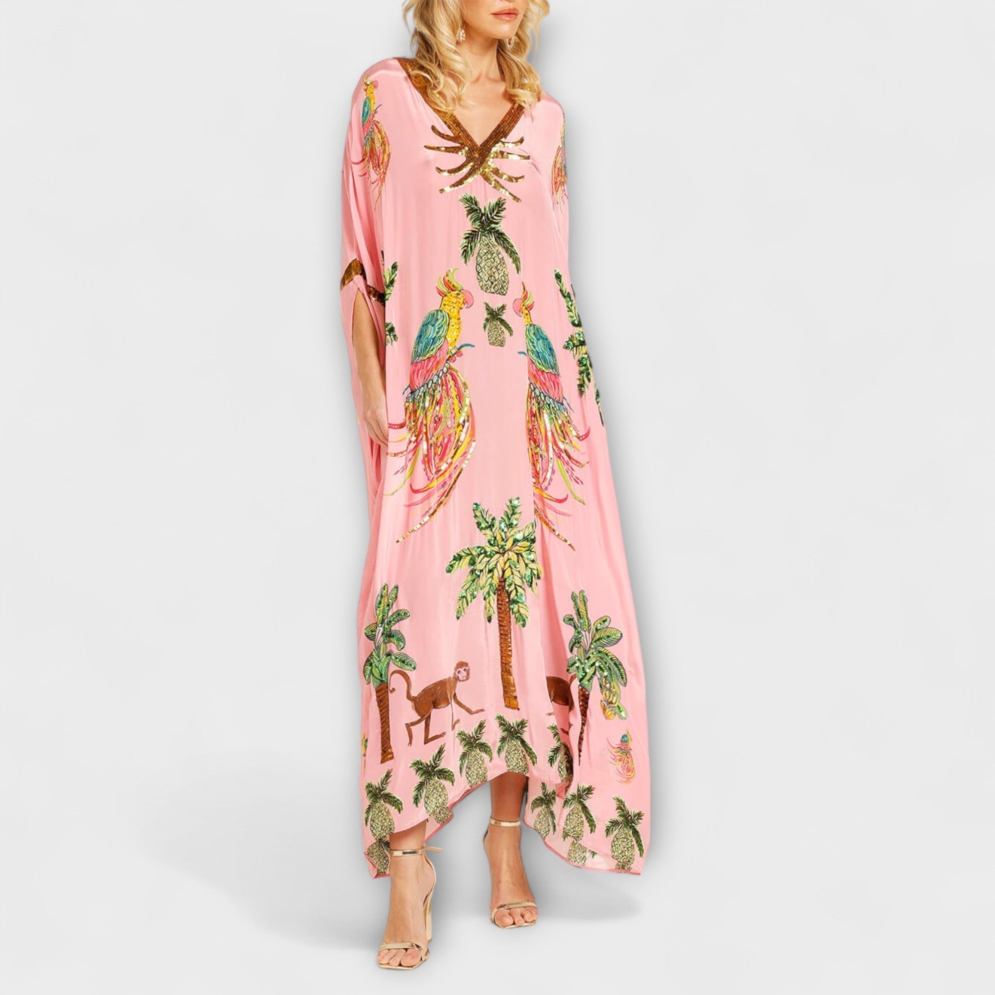 Linda - Iögonfallande klänning med off-shoulder-design och kokosnötsträdsmönster