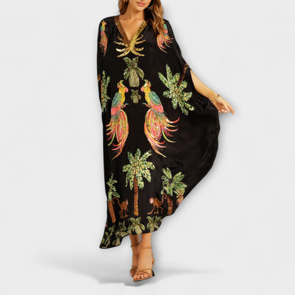 Linda - Iögonfallande klänning med off-shoulder-design och kokosnötsträdsmönster
