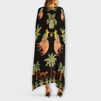 Linda - Iögonfallande klänning med off-shoulder-design och kokosnötsträdsmönster